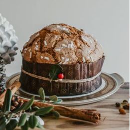 Artisan panettone with candied citrus fruits, raisins and almonds