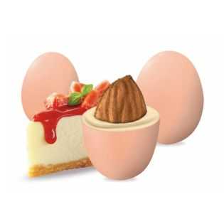 Pastel peach-colored chocolate dragees, created by Enzo Miccio with a cheesecake flavor