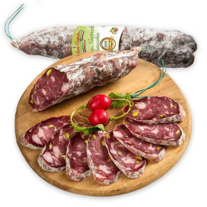 Sicilian salami cut in half, with Sicilian pistachios