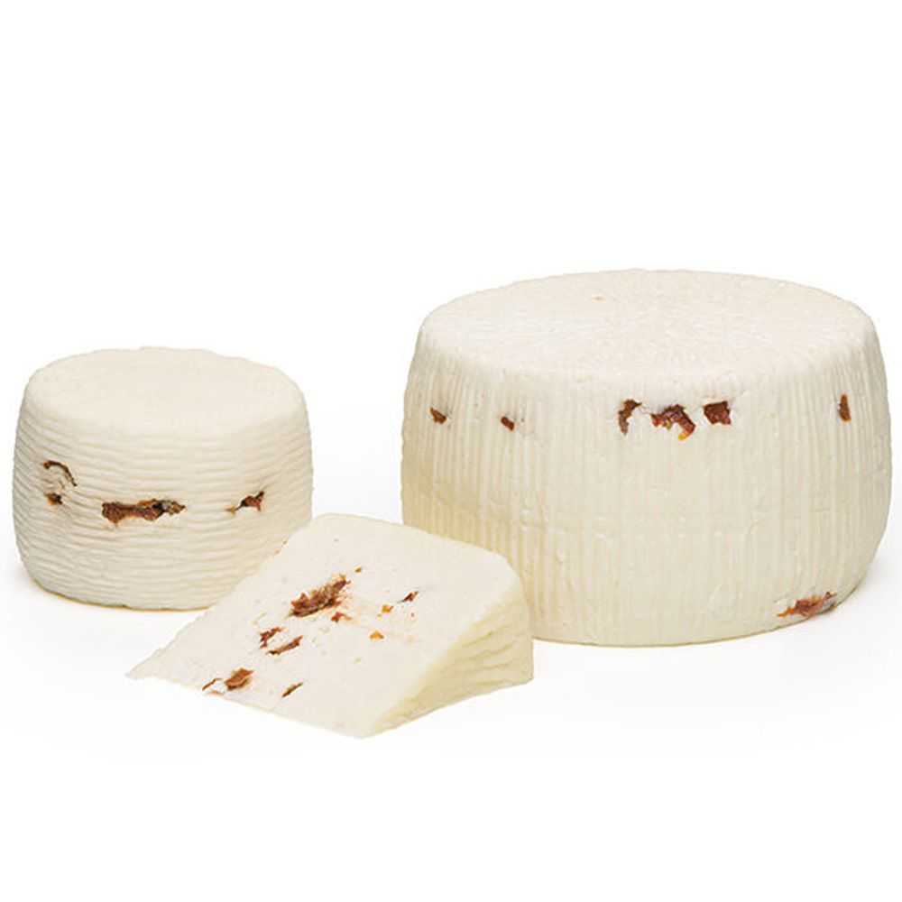 Primo Sale Canestrato cheese enriched with dry tomatoes Primo Sale Canestrato cheese enriched with dry tomatoes