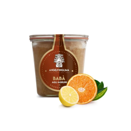 The soft dough of Babà in jar cooking flavored with citrus fruits