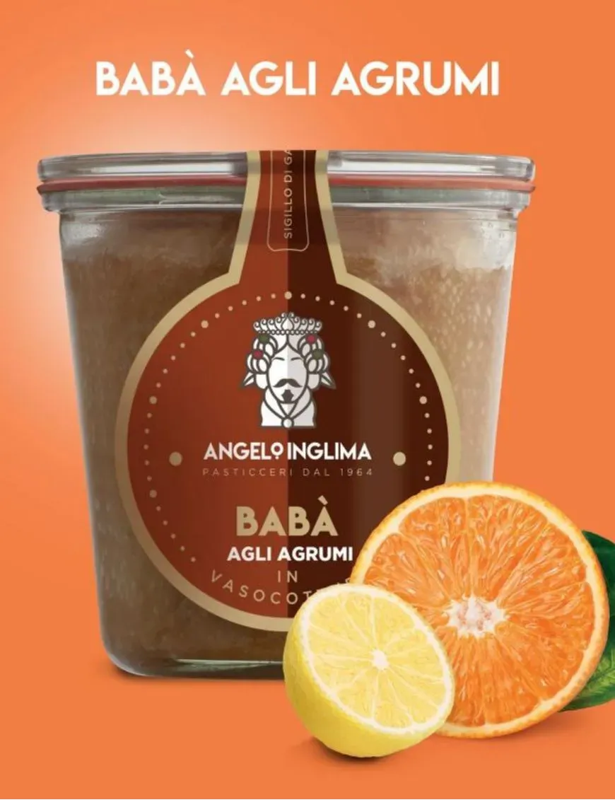 The soft dough of Babà in jar cooking flavored with citrus fruits